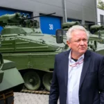 Armin Papperger, CEO of Rheinmetall, stands in front of reconditioned Marder infantry fighting vehicles during a tour of the firm's Unterluess plant in Lower Saxony, Germany on 14 July 2022.